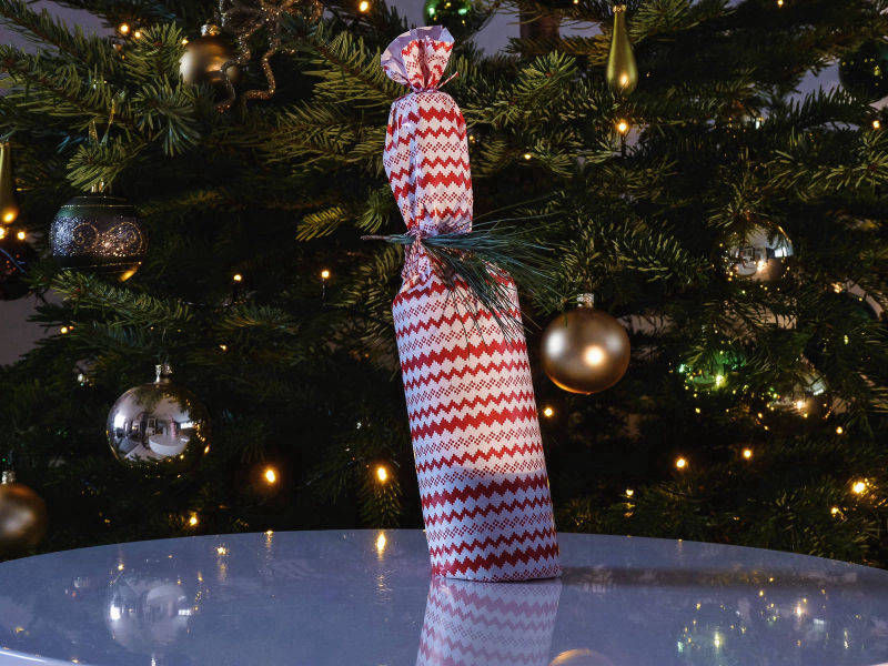 Ingepakte kerst fles drunken mel caramel likeur